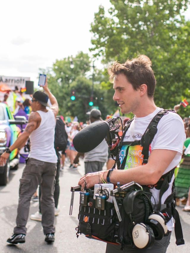 Sound mixer wearing a production sound bag rig